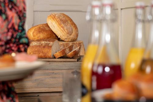 a pile of bread sitting on top of a table at Manor House Hotel in Bishop Auckland