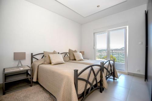 Katil atau katil-katil dalam bilik di Luxury Villa Fig with pool and Jacuzzi near Dubrovnik