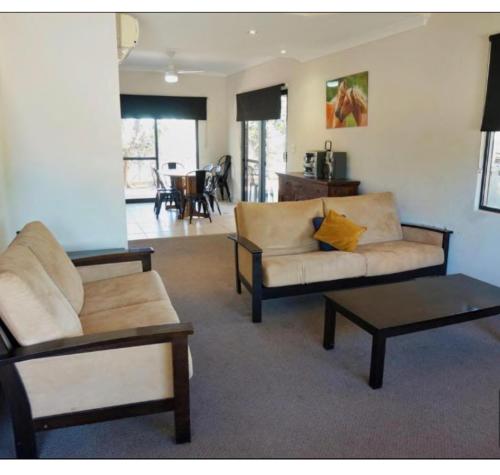 a living room with two couches and a coffee table at The Ningaloo breeze villa 6 in Exmouth