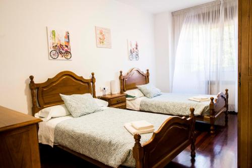 A bed or beds in a room at Las Aceñas De Iris