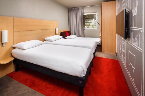 Postel nebo postele na pokoji v ubytování ibis London Wembley