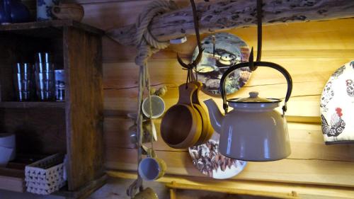 a tea kettle is hanging on a wall at Bardu Huskylodge in Bardu