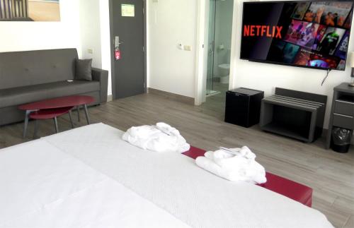 Ένα ή περισσότερα κρεβάτια σε δωμάτιο στο Los Álamos