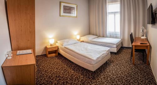 Postel nebo postele na pokoji v ubytování Hotel Brixen