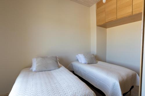 Ένα ή περισσότερα κρεβάτια σε δωμάτιο στο Marina Resort A7
