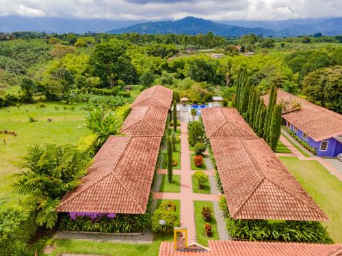 an aerial view of a resort with a row of roofs at Hotel Campestre Solar De La Luna in Armenia