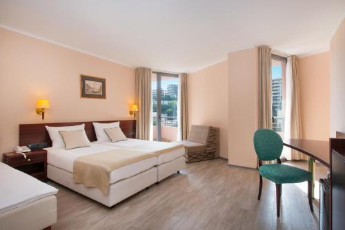 Postel nebo postele na pokoji v ubytování Iberostar Waves Bellevue All Inclusive