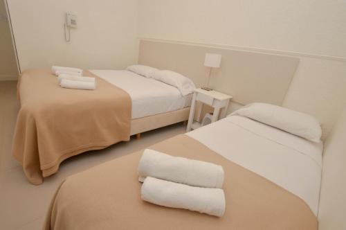 Postel nebo postele na pokoji v ubytování Hotel Acqua
