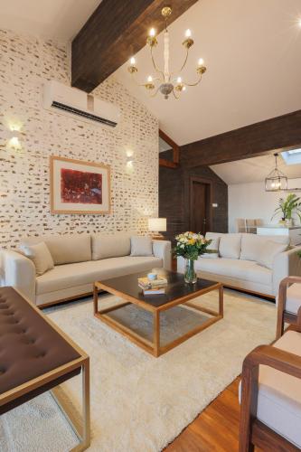 a living room with two couches and a coffee table at Colombo3 in Colombo