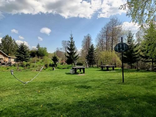 a park with a picnic table and a playground at Śnieżnicki Domek - Masyw Śnieżnika, Sudety in Stronie Śląskie