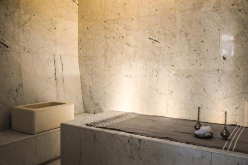 a bathroom with a tub and a sink at D-Resort Šibenik in Šibenik