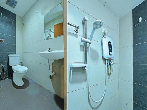 a bathroom with a shower and a toilet and a sink at OYO 90510 Hotel Sahara in Johor Bahru