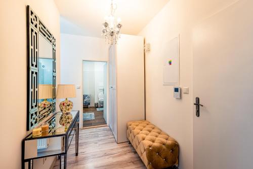 a living room with a couch and a table at Apartmán Sabína in Liptovský Mikuláš