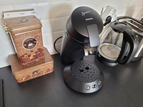 a counter top with a coffee maker and a blender at Le 3plex - Coeur de Vertou - Original in Vertou