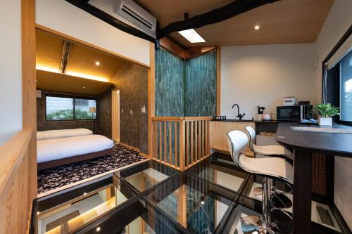 a bedroom in a house with a bed and a counter at 京恋 竹林邸 in Kyoto