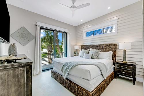 a bedroom with a large bed and a window at Endless Summer in Sarasota