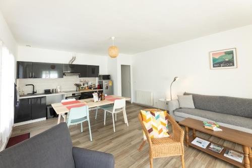 a living room with a couch and a table at Maison Gure Chokoa Pays Basque in Bardos