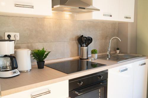 a kitchen with a sink and a counter top at Le Rotche III in La Roche-en-Ardenne