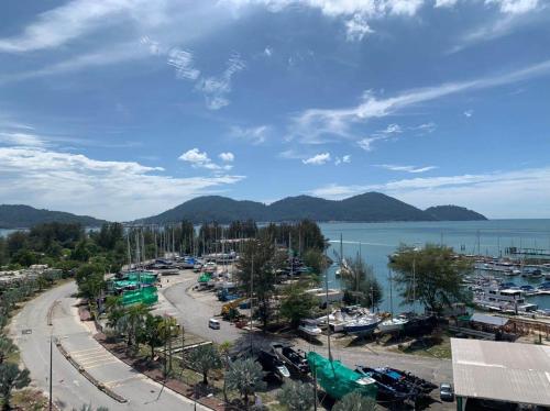 a view of a marina with boats in the water at Glossy Marina Homestays in Lumut