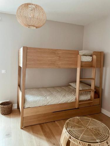 a wooden bunk bed in a room at Appartement Biarritz hypercentre calme, plage à 350m in Biarritz