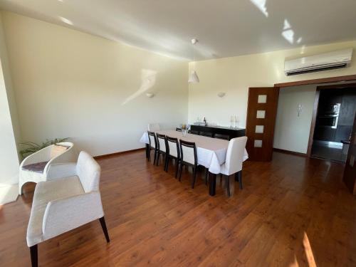 a dining room with a table and chairs at Herdade do Gizo - Casa Reis in Cuba