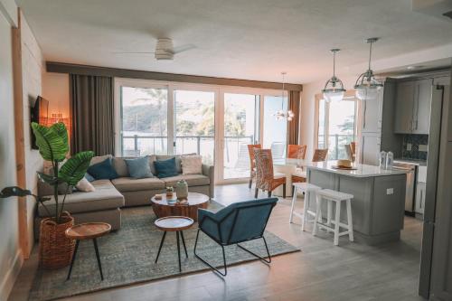 a living room with a couch and a table at Secret Harbour Beach Resort in St Thomas