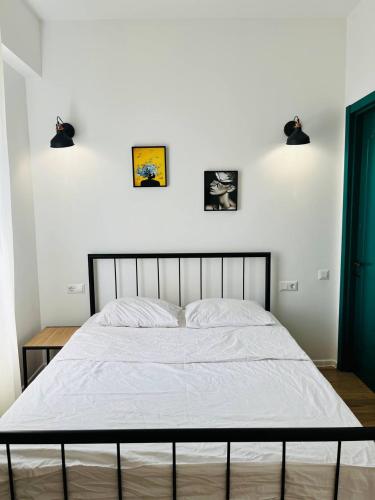 Ένα ή περισσότερα κρεβάτια σε δωμάτιο στο Ortachala Apartments