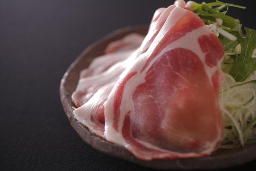 a close up of a piece of meat with a salad at Sakaeya in Yamanouchi