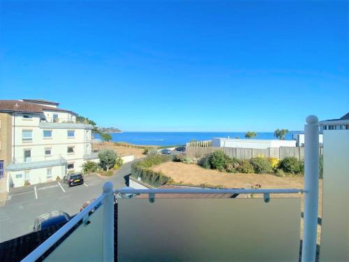 a balcony with a view of the ocean at Cliff Court Apartments in Torquay