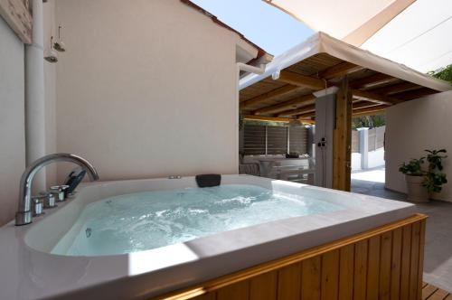 a jacuzzi tub in the backyard of a house at Angel luxury villa in Petrití