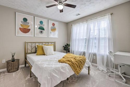 a bedroom with a bed and a ceiling fan at Boho Union City Home Less Than 20 Mi to Dtwn Atlanta! in Union City