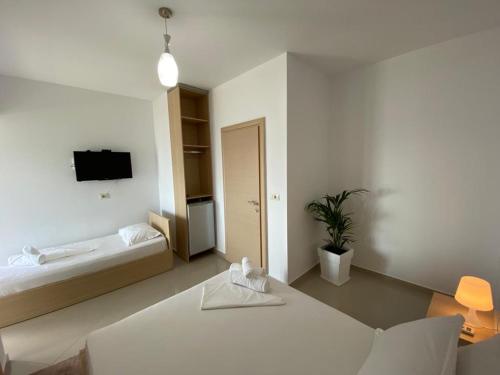 Katil atau katil-katil dalam bilik di Emily Boutique Hotel