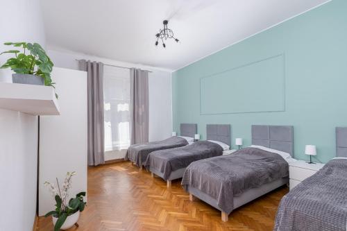 Posteľ alebo postele v izbe v ubytovaní Brzozowa Apartments by Hostly