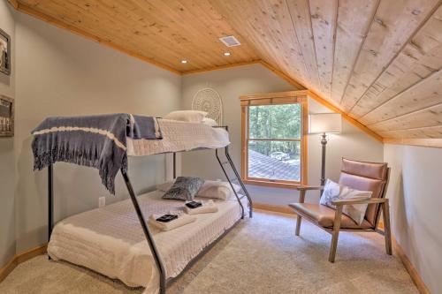 a bedroom with a bunk bed and a chair at Secluded Leesburg Retreat with Private Hot Tub! in Middleburg