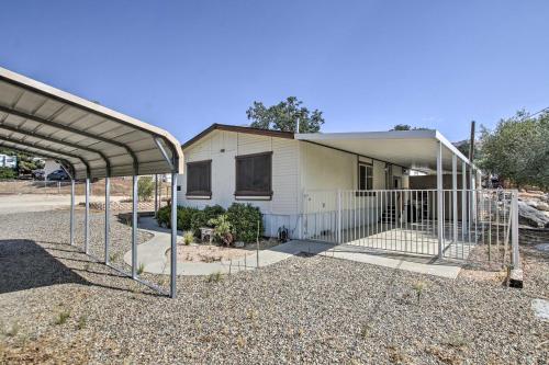 a house with a gate in front of it at Family-Friendly Home about 1 Mi to Kern River! in Wofford Heights