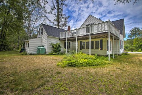 a house with a large yard in front of it at Modern Home about 2 Mi to Cranmore Mountain Resort! in Conway
