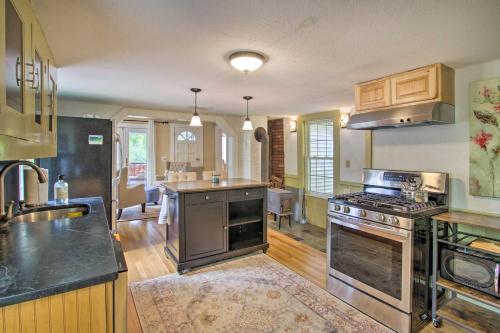 a kitchen with a stove top oven in a room at Modern Home about 2 Mi to Cranmore Mountain Resort! in Conway