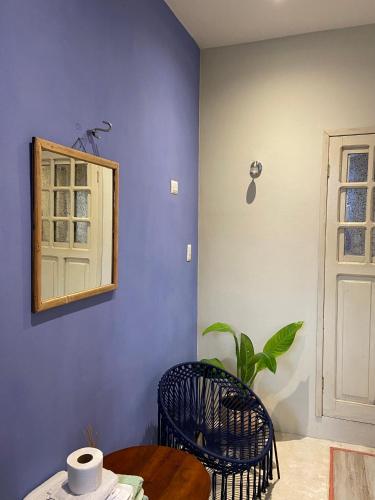 a room with a table and a mirror on the wall at Yuum Bo'tik, Hotel Real Maya 2 in Valladolid