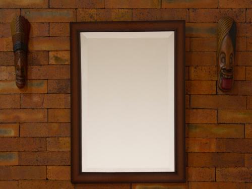 a blank picture frame hanging on a brick wall at Blanca María in San Francisco