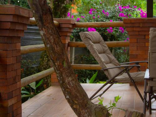 a chair sitting on a deck next to a fence at Blanca María in San Francisco
