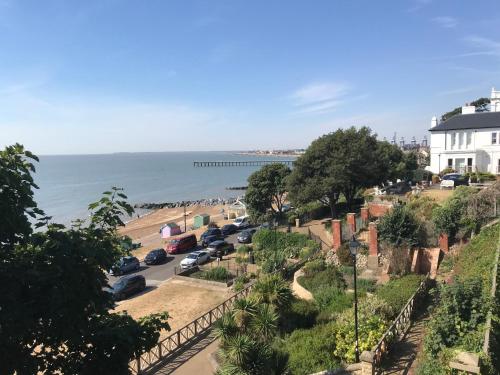 a view of a beach with cars parked at Luxurious Beach House with spectacular sea views in Felixstowe