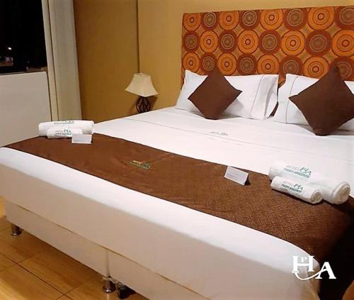 Ένα ή περισσότερα κρεβάτια σε δωμάτιο στο Hotel Puerto Amazonico