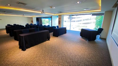 a room with rows of chairs and tables in it at Holiday Inn Express Culiacan by IHG in Culiacán