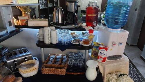 a counter with a table with a blender and other items at Vila Vista Вила Виста in Sveti Vlas