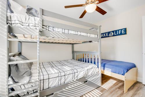a bedroom with bunk beds and a ceiling fan at Norris Lake Escape in Maynardville