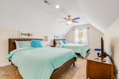 a bedroom with two beds and a ceiling fan at Norris Lake Escape in Maynardville