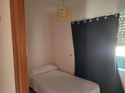 Cama o camas de una habitación en Apartamentos Casa May III - Centro Benidorm
