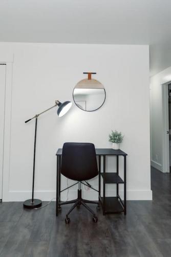 an office with a desk and a chair and a lamp at Cheerful 3 Bedroom near USU - Inspiring Memories in Logan