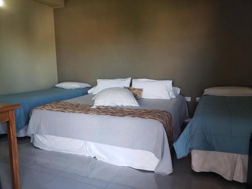 Una cama o camas en una habitación de Marvic Hotel