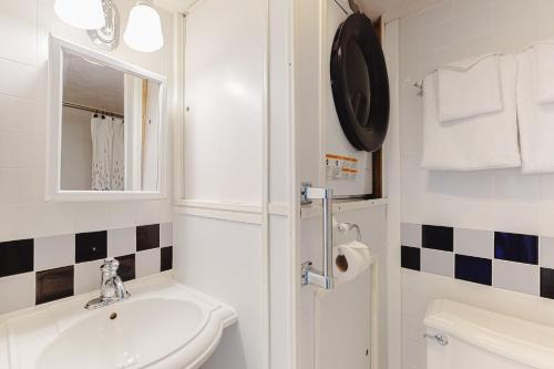 a white bathroom with a sink and a toilet at Highpoint S 6H in Ocean City